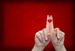 Conceptual human or female hands with two fingers painted with