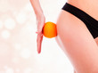 Photo: female figure with an orange, pastel blurred background female figure with an orange, pastel blurred background