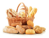 Bread and rolls in wicker basket isolated on white