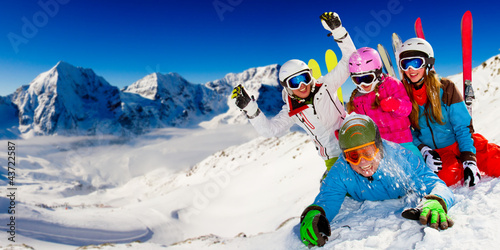 Photo: Skiing, winter fun - happy family ski team Skiing, winter fun - happy family ski team