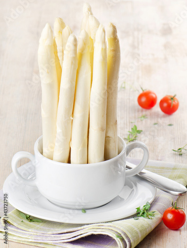 Photo: white asparagus on wooden table white asparagus on wooden table