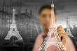 Businessman drawing Eiffel Tower line  in Paris.