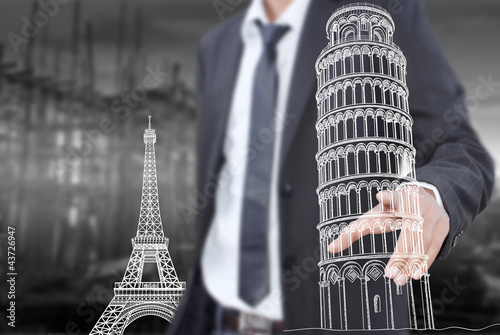 Photo: Businessman pushing Pisa Tower line in Italy for construction. Businessman pushing Pisa Tower line in Italy for construction.