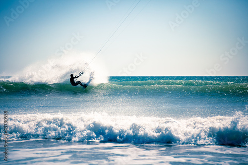 Photo: Kite surfing in waves. Kite surfing in waves.