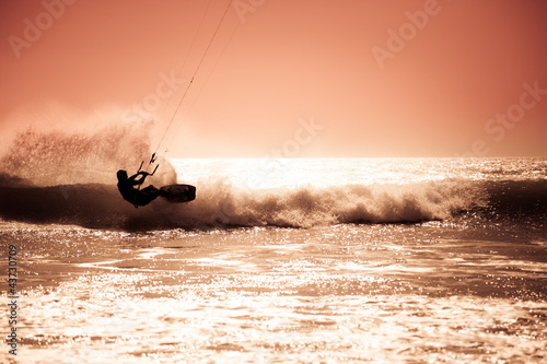 Photo: Kite surfing in waves. Kite surfing in waves.
