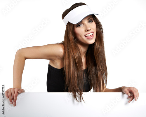 Foto: Sexy woman holding a blank billboard. Sexy woman holding a blank billboard.