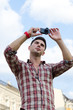 Foto: Man taking a photograph Man taking a photograph