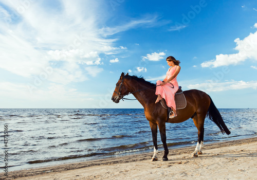 Photo: beautiful girl with horse on seacoast beautiful girl with horse on seacoast