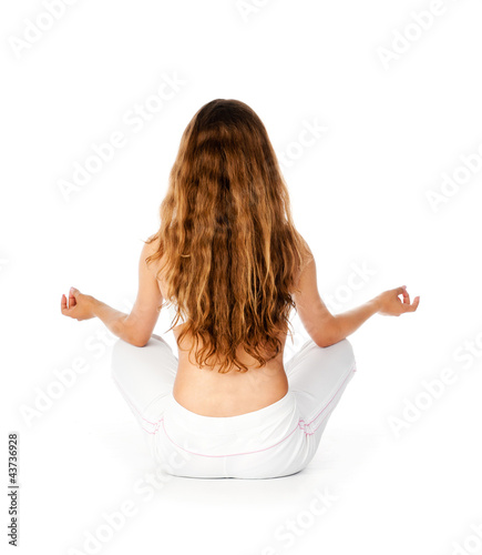 Photo: young woman sitting in yoga pose young woman sitting in yoga pose