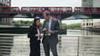Video: Young business people with tablet in the city Young business people with tablet in the city