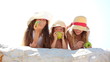 Little girls eating apples