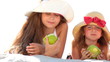 Little girls eating apples