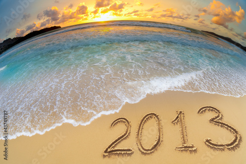 Photo: new year 2013 digits on ocean beach sand new year 2013 digits on ocean beach sand