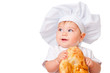 Little boy in a cap eat bread