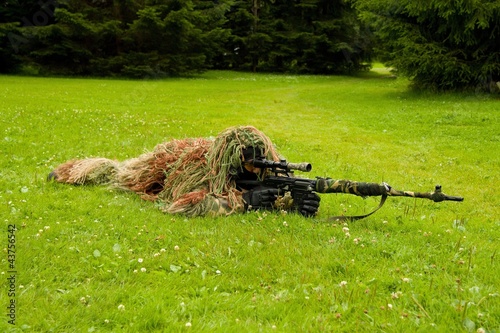 Photo: Masked man with a gun Masked man with a gun
