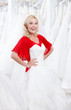 Young girl puts a wedding dress to her body
