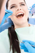 Dentist examines the oral cavity of a young patient
