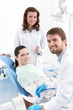 Photo: Dentist, assistant and the patient are ready for treating Dentist, assistant and the patient are ready for treating