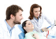 The patient thoroughly examines the x ray photo of the teeth