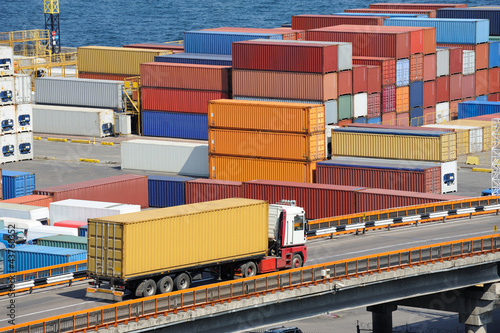 Photo: truck transport container to warehouse near sea truck transport container to warehouse near sea