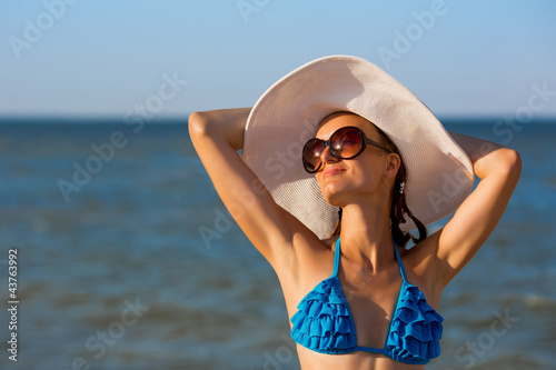 Photo: Girl relaxing on the beach Girl relaxing on the beach