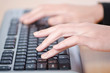 Foto: Hands typing on the keyboard Hands typing on the keyboard
