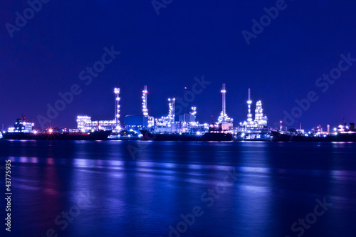 Photo: Oil refinery plant along river in Bangkok Oil refinery plant along river in Bangkok