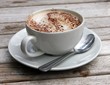 Cup of Cappuccino on wooden slat table