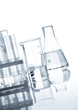 Glass flasks with a clear liquid, isolated
