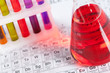 Set of test tubes and flask with colored liquids