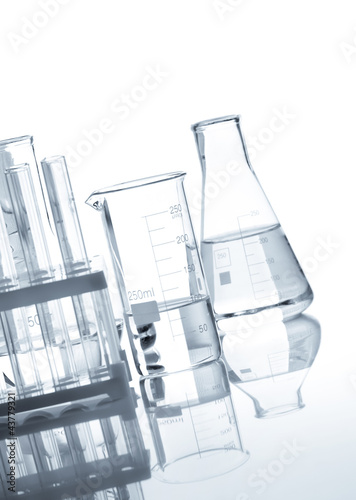Photo: Glass flasks with a clear liquid, isolated Glass flasks with a clear liquid, isolated