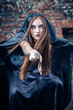Portrait of a young witch. Halloween, horror.