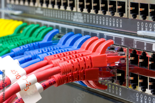 Photo: Network switch and UTP ethernet cables Network switch and UTP ethernet cables