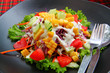 Fresh mixed salad with tomatoes, corn, red cabbage