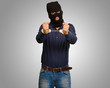 angry criminal man locked in handcuffs