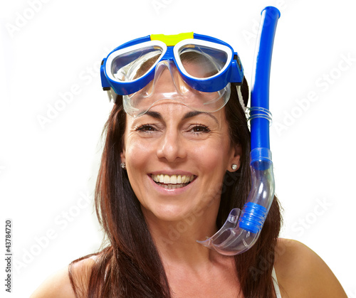 Photo: portrait of a happy middle aged woman wearing snorkel and goggle portrait of a happy middle aged woman wearing snorkel and goggle