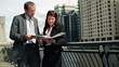 Video: Successful business people with documents in the city Successful business people with documents in the city