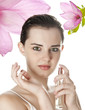 young woman applying fresh perfume - white background