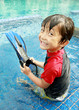 Photo: kid having fun in the pool kid having fun in the pool
