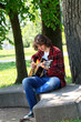 Photo: young man playing the guitar young man playing the guitar