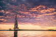 Submerged bell tower in river on a beautiful sunrise