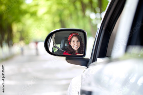 Photo: smiling woman driving smiling woman driving