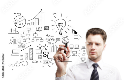 Photo: man drawing plan man drawing plan