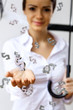 Business woman under money rain with umbrella