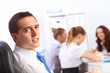 Foto: Young businessmen working in the office Young businessmen working in the office