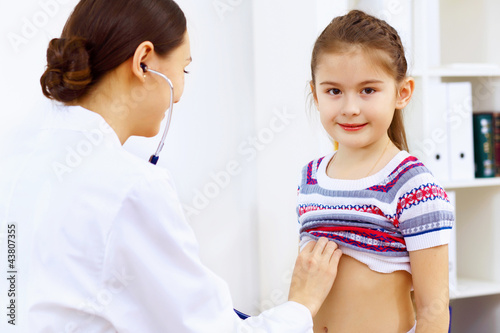 Photo: Little girl and a doctor Little girl and a doctor