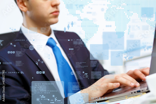 Photo: Business person working on computer Business person working on computer