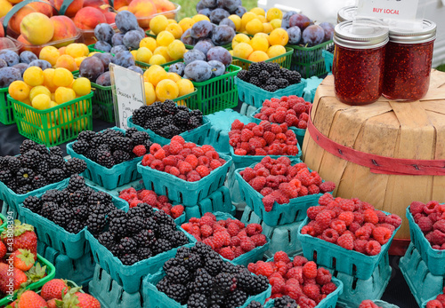 Photo: Berries and plums at farmers market Berries and plums at farmers market