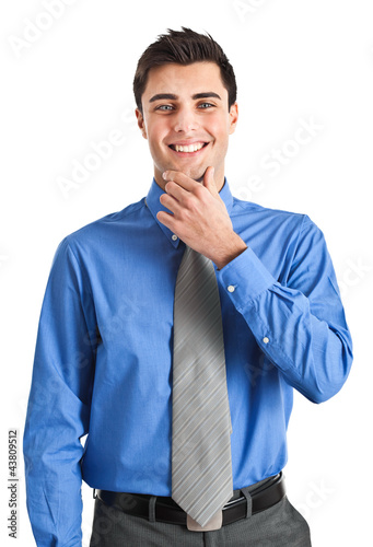 Photo: Handsome young businessman portrait isolated on white Handsome young businessman portrait isolated on white
