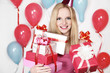 Photo: Sexy young blonde girl holding a gift Sexy young blonde girl holding a gift